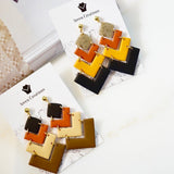 Chevron Polymer Clay Dangle Earrings. Cute, modern multicolor four tiered chevron clay earrings.  These are stylish and lightweight measuring 2.5" long from top to bottom.