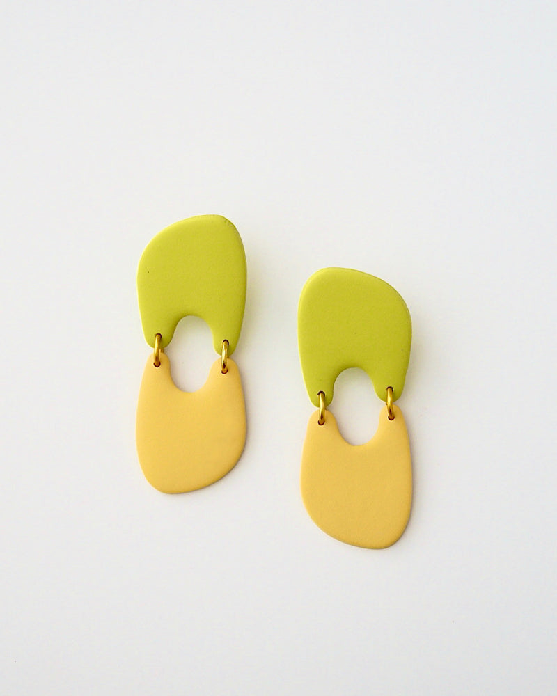 Handmade Color Blocking Two Tone Polymer Clay Statement Earrings.  These modern clay dangles are a standout.  Available with hypoallergenic titanium posts or clip-on option. Stylish, lightweight and effortless, these organic abstract earrings are retro-inspired for a chic look.