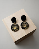 Handmade Brass & Black Polymer Clay Statement Earrings. Modern clay dangles with brass sunburst charms. Available with hypoallergenic titanium posts or clip-on option. These are stylish, lightweight and will be a standout for a chic daytime look or a night out.