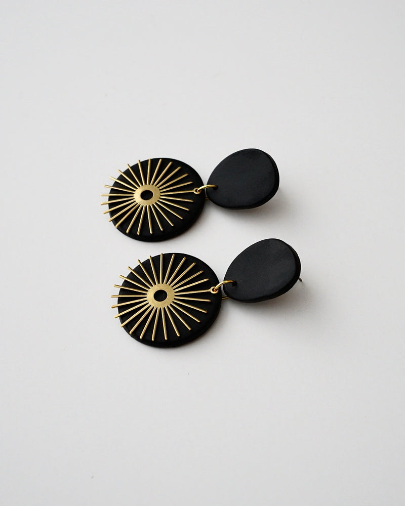 Handmade Brass & Black Polymer Clay Statement Earrings.  Modern clay dangles with brass sunburst charms. Available with hypoallergenic titanium posts or clip-on option. These are stylish, lightweight and will be a standout for a chic daytime look or a night out. 