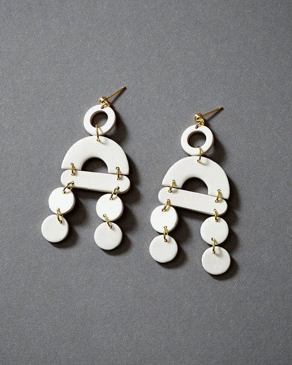 Handmade Ivory Polymer Clay Statement Earrings.  These modern and lightweight clay dangles bring movement and style to your day or evening.  Geometric. earrings with a touch of boho vibe. Hypoallergenic gold plated earring posts.