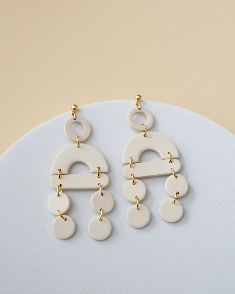 Handmade Ivory Polymer Clay Statement Earrings.  These modern and lightweight clay dangles bring movement and style to your day or evening.  Geometric. earrings with a touch of boho vibe. Hypoallergenic gold plated earring posts.
